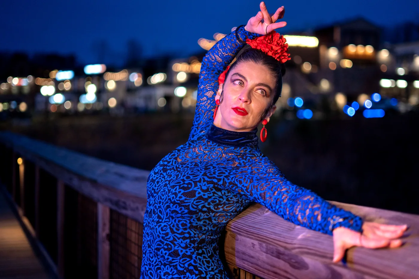 A flamenco dancer in a ruffled dress mid-movement