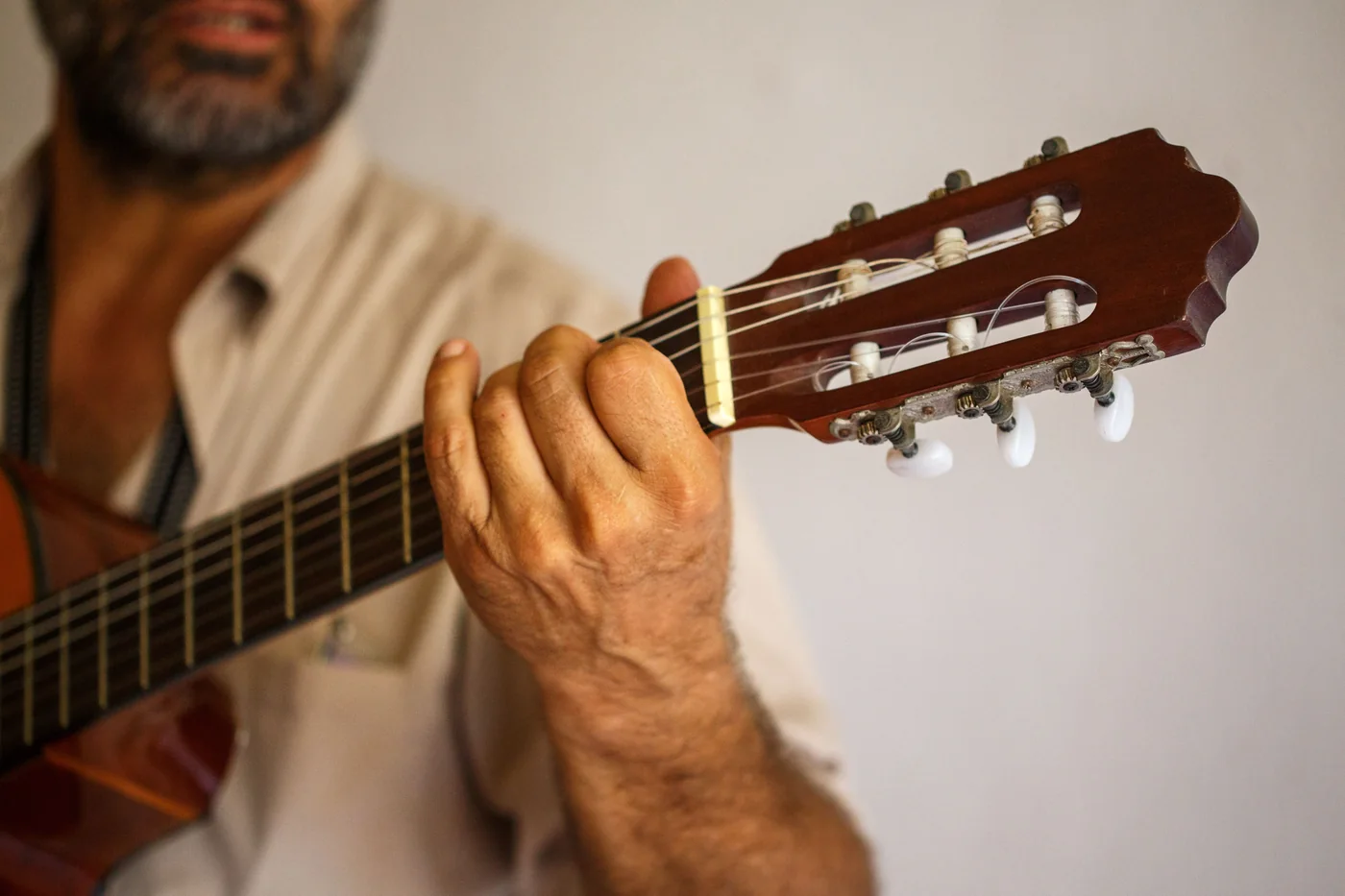 A flamenco guitarist playing on a small stage